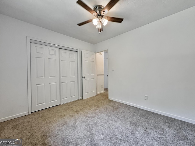 10173 Brass Ring Rd, Jonesboro, GA 30238 - unfurnished bedroom with carpet floors, a closet, and a ceiling fan