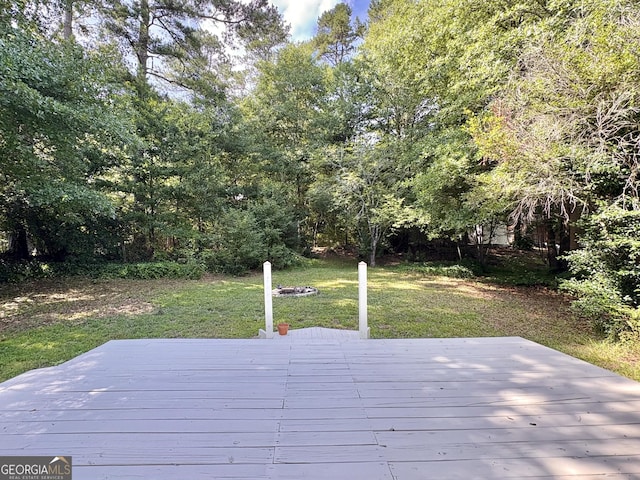 10173 Brass Ring Rd, Jonesboro, GA 30238 - wooden terrace with a lawn