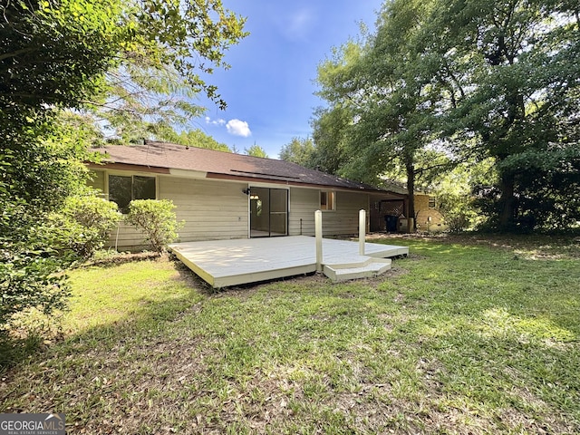 10173 Brass Ring Rd, Jonesboro, GA 30238 - back of property with a deck and a lawn