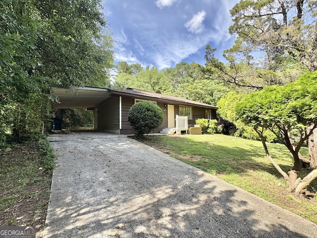 10173 Brass Ring Rd, Jonesboro, GA 30238 - ranch-style home with concrete driveway, a front lawn, and a carport