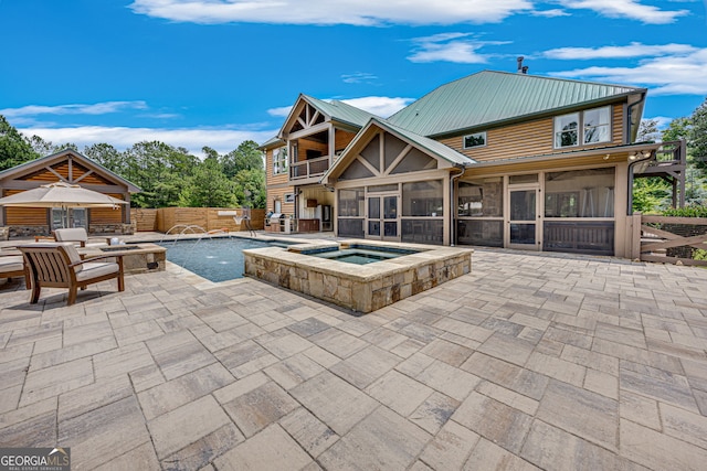 6590 Lights Ferry Rd, Flowery Branch, GA 30542 - view of pool featuring a sunroom, a patio area, an outdoor fire pit, and a pool with connected hot tub