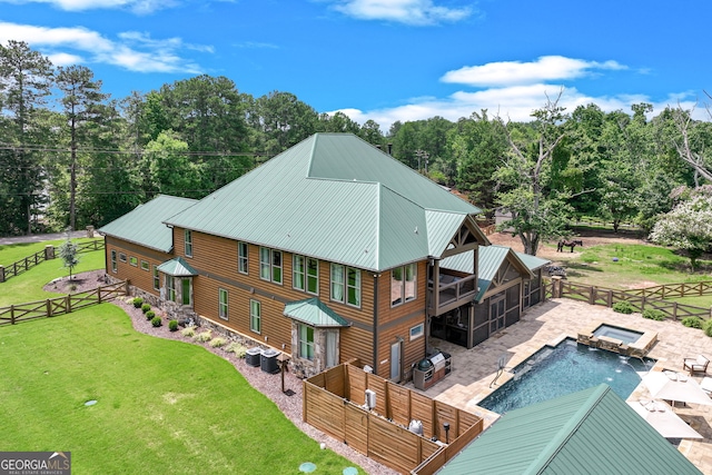 6590 Lights Ferry Rd, Flowery Branch, GA 30542 - back of house with a fenced backyard, a patio, a pool with connected hot tub, and a metal roof