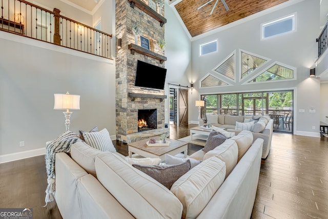 6590 Lights Ferry Rd, Flowery Branch, GA 30542 - living room featuring high vaulted ceiling, a fireplace, healthy amount of natural light, dark wood-type flooring, and wood ceiling