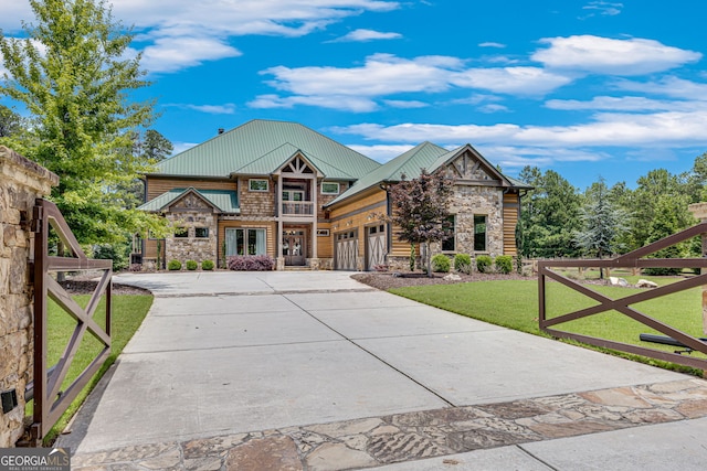6590 Lights Ferry Rd, Flowery Branch, GA 30542 - view of front of property featuring stone siding, a front lawn, an attached garage, concrete driveway, and a standing seam roof