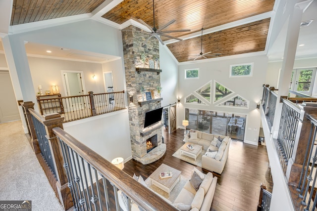 6590 Lights Ferry Rd, Flowery Branch, GA 30542 - living area featuring ceiling fan, a stone fireplace, high vaulted ceiling, wooden ceiling, and wood finished floors