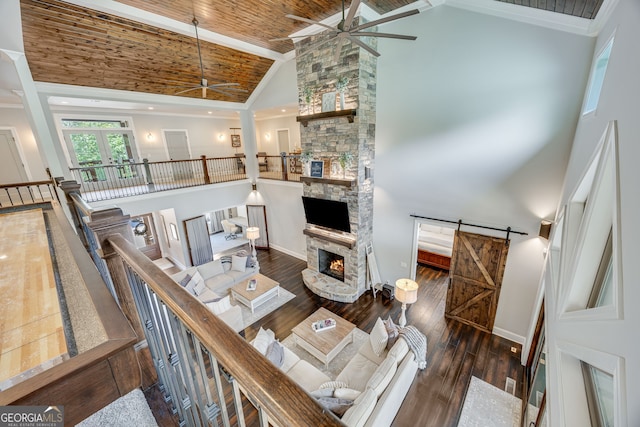 6590 Lights Ferry Rd, Flowery Branch, GA 30542 - living area featuring a ceiling fan, a stone fireplace, high vaulted ceiling, wood-type flooring, and french doors