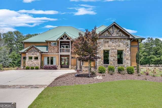 6590 Lights Ferry Rd, Flowery Branch, GA 30542 - view of front of property featuring stone siding, a front lawn, a metal roof, and a standing seam roof