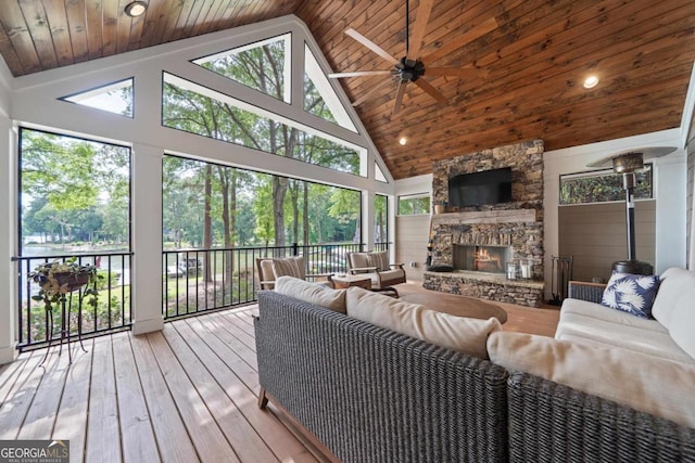 1320 Dogwood Drive 1320Dogwood Drive, Greensboro, GA 30642 - living room with high vaulted ceiling, a stone fireplace, a ceiling fan, hardwood / wood-style floors, and wooden ceiling