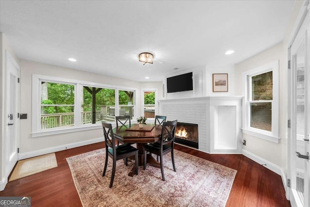 4735 Log Cabin Rd, Gainesville, GA 30504 - dining space featuring plenty of natural light, a fireplace, wood finished floors, and recessed lighting