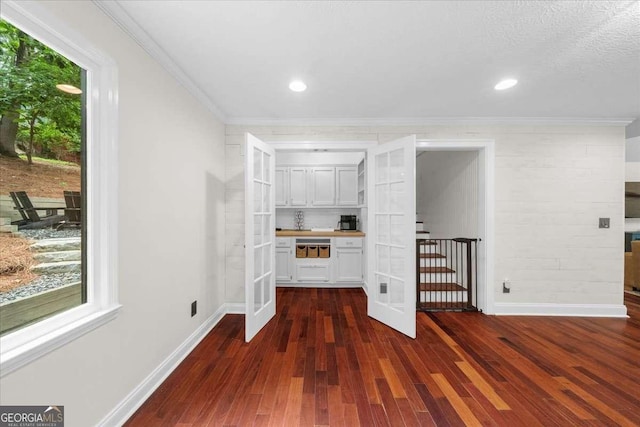 4735 Log Cabin Rd, Gainesville, GA 30504 - bar area with dark wood-style floors, french doors, ornamental molding, and recessed lighting