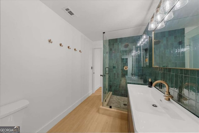 4735 Log Cabin Rd, Gainesville, GA 30504 - bathroom with wood finished floors, a stall shower, and vanity