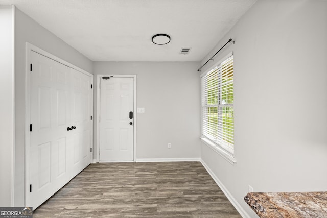 615 Coan Dr, Locust Grove, GA 30248 - foyer entrance featuring wood finished floors and baseboards
