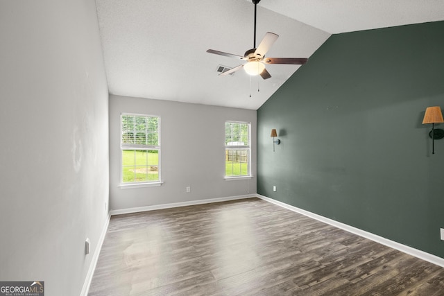 615 Coan Dr, Locust Grove, GA 30248 - unfurnished room with a ceiling fan, wood finished floors, and high vaulted ceiling