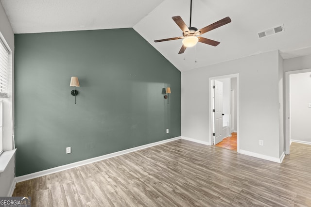 615 Coan Dr, Locust Grove, GA 30248 - unfurnished bedroom featuring wood finished floors, lofted ceiling, ensuite bathroom, and ceiling fan