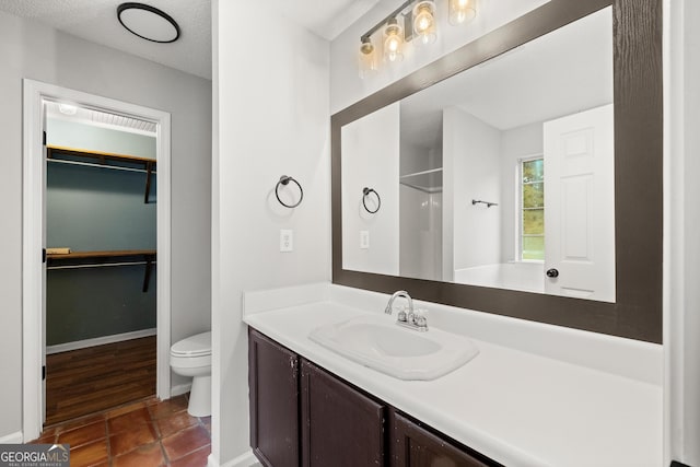 615 Coan Dr, Locust Grove, GA 30248 - full bath with vanity, a spacious closet, a shower, and tile patterned flooring