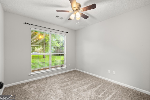 615 Coan Dr, Locust Grove, GA 30248 - carpeted spare room with a ceiling fan and a textured ceiling