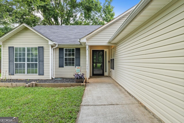615 Coan Dr, Locust Grove, GA 30248 - entrance to property featuring roof with shingles and a lawn