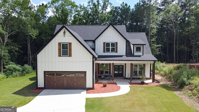 181 S Chattahoochee Dr, Hogansville, GA 30230 - modern farmhouse featuring a shingled roof, covered porch, a garage, a front lawn, and board and batten siding