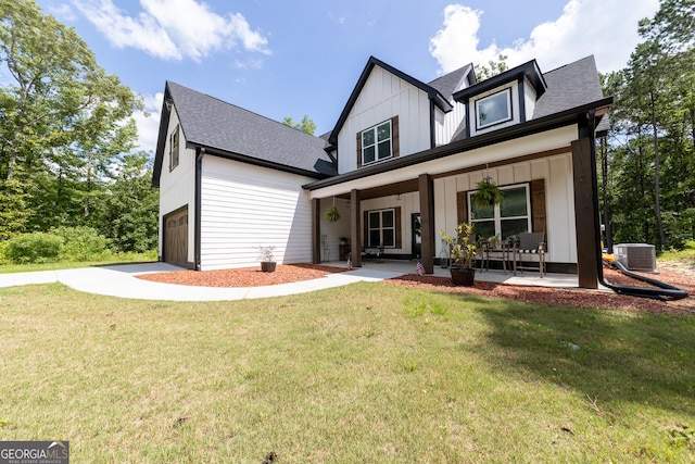 181 S Chattahoochee Dr, Hogansville, GA 30230 - view of front of home featuring covered porch, board and batten siding, roof with shingles, a front lawn, and driveway