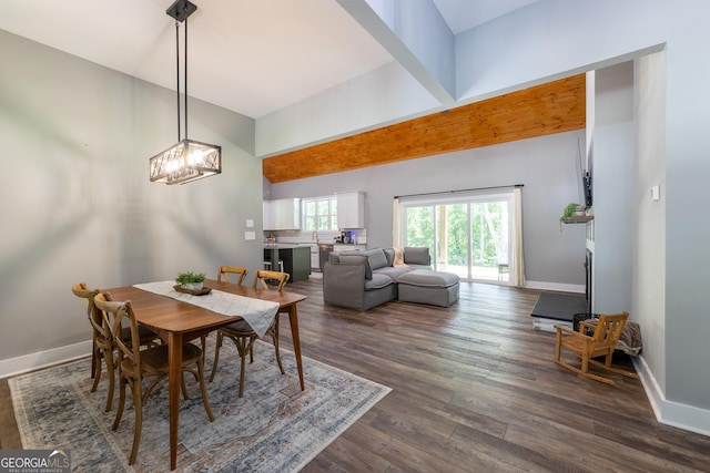 181 S Chattahoochee Dr, Hogansville, GA 30230 - dining room featuring dark wood-style floors, a chandelier, and lofted ceiling