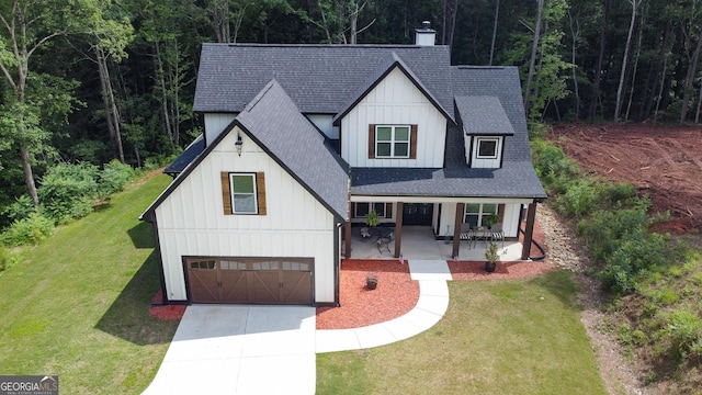 181 S Chattahoochee Dr, Hogansville, GA 30230 - modern inspired farmhouse featuring roof with shingles, board and batten siding, covered porch, an attached garage, and concrete driveway