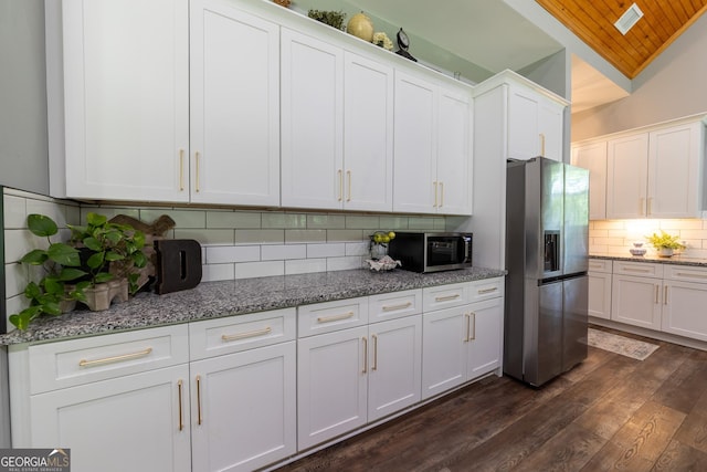 181 S Chattahoochee Dr, Hogansville, GA 30230 - kitchen featuring appliances with stainless steel finishes, backsplash, dark wood-style floors, white cabinets, and stone counters