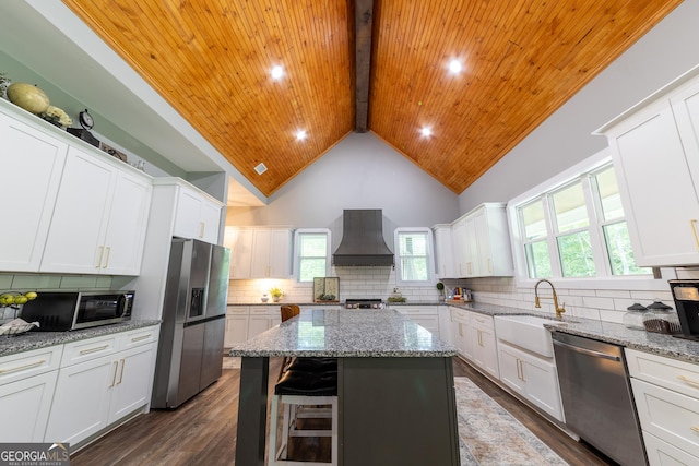 181 S Chattahoochee Dr, Hogansville, GA 30230 - kitchen with appliances with stainless steel finishes, custom range hood, a wooden ceiling with exposed beams, a kitchen island, and healthy amount of natural light