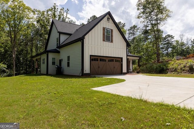 181 S Chattahoochee Dr, Hogansville, GA 30230 - view of home's exterior featuring board and batten siding, driveway, an attached garage, a lawn, and a shingled roof