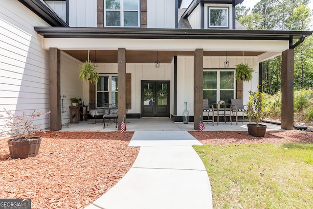181 S Chattahoochee Dr, Hogansville, GA 30230 - property entrance featuring board and batten siding, french doors, and covered porch