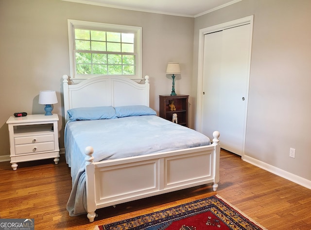723 Fricks Ln, Rossville, GA 30741 - bedroom featuring ornamental molding, wood finished floors, and a closet