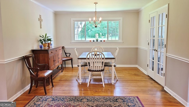 723 Fricks Ln, Rossville, GA 30741 - dining room featuring wood finished floors, a chandelier, crown molding, and french doors