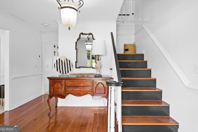 100 Merrill Dr, Lagrange, GA 30241 - staircase featuring wood finished floors, crown molding, and a textured ceiling