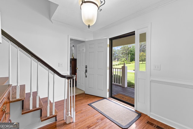 100 Merrill Dr, Lagrange, GA 30241 - foyer featuring stairs, light wood-type flooring, and ornamental molding