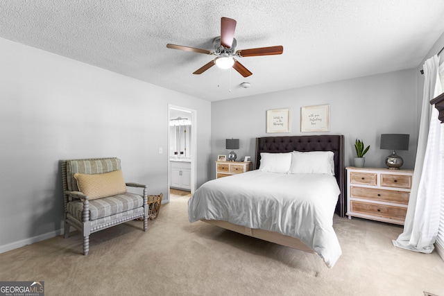 100 Merrill Dr, Lagrange, GA 30241 - carpeted bedroom featuring a textured ceiling, connected bathroom, and a ceiling fan