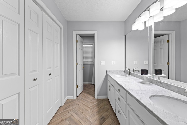 100 Merrill Dr, Lagrange, GA 30241 - full bathroom with a closet, double vanity, and a textured ceiling