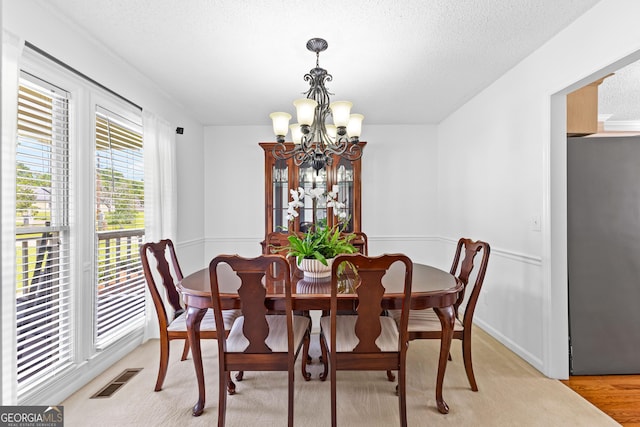 100 Merrill Dr, Lagrange, GA 30241 - dining area with a chandelier and a textured ceiling