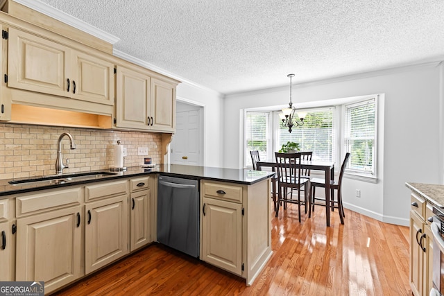 100 Merrill Dr, Lagrange, GA 30241 - kitchen with stainless steel dishwasher, a textured ceiling, a peninsula, hardwood / wood-style flooring, and decorative backsplash