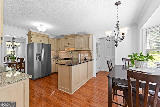 100 Merrill Dr, Lagrange, GA 30241 - kitchen featuring stainless steel fridge, a chandelier, wood finished floors, ornamental molding, and a textured ceiling