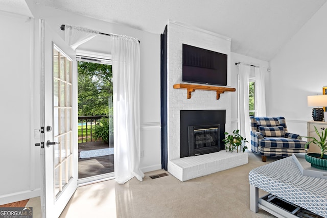 100 Merrill Dr, Lagrange, GA 30241 - carpeted living room featuring a brick fireplace and vaulted ceiling