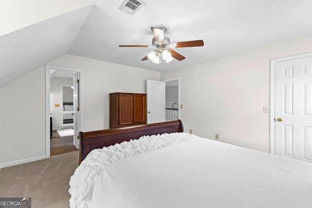 100 Merrill Dr, Lagrange, GA 30241 - bedroom with light colored carpet, a textured ceiling, lofted ceiling, and a ceiling fan