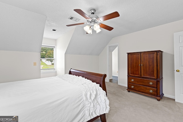 100 Merrill Dr, Lagrange, GA 30241 - bedroom with vaulted ceiling, light carpet, a textured ceiling, and ceiling fan