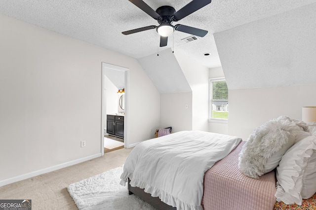 100 Merrill Dr, Lagrange, GA 30241 - bedroom with light colored carpet, a textured ceiling, lofted ceiling, ceiling fan, and connected bathroom