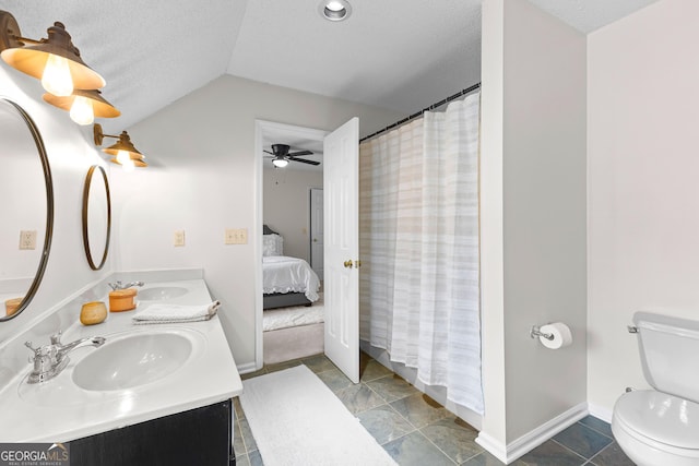 100 Merrill Dr, Lagrange, GA 30241 - ensuite bathroom with vaulted ceiling, double vanity, a shower with shower curtain, a ceiling fan, and a textured ceiling