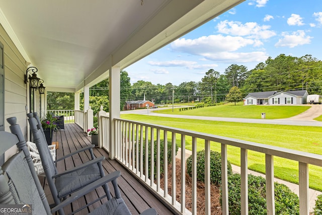 100 Merrill Dr, Lagrange, GA 30241 - porch featuring a lawn and view of wooded area