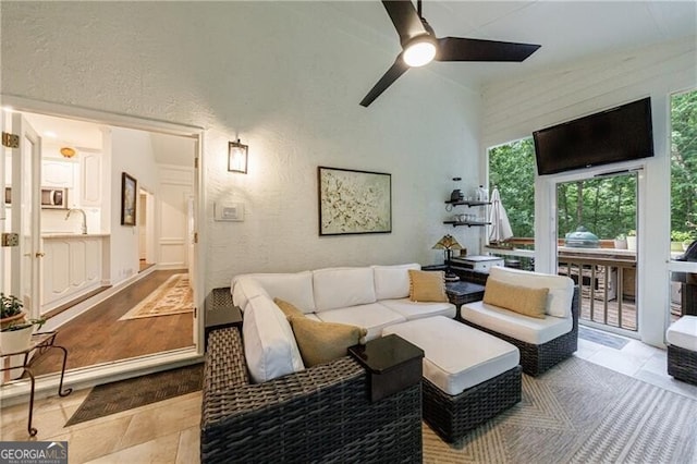 525 Avala Ct, Johns Creek, GA 30022 - living area featuring a ceiling fan, a textured wall, and tile patterned floors