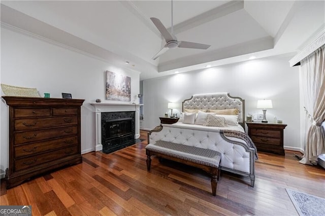 525 Avala Ct, Johns Creek, GA 30022 - bedroom featuring a high end fireplace, wood finished floors, recessed lighting, a ceiling fan, and a tray ceiling