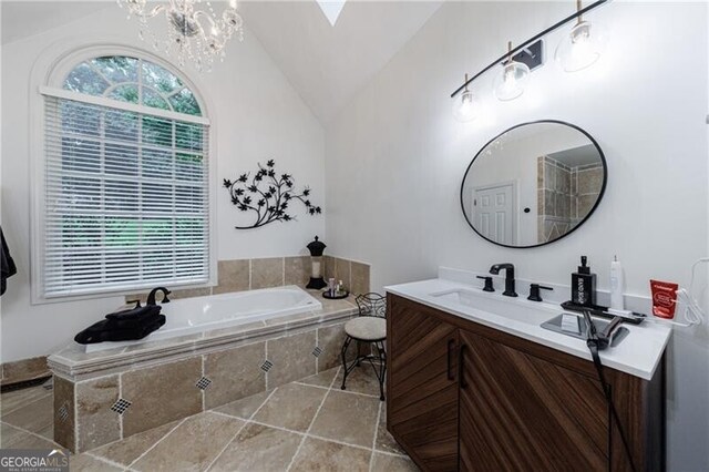 525 Avala Ct, Johns Creek, GA 30022 - bathroom featuring vanity, lofted ceiling, a bath, a chandelier, and tile patterned floors