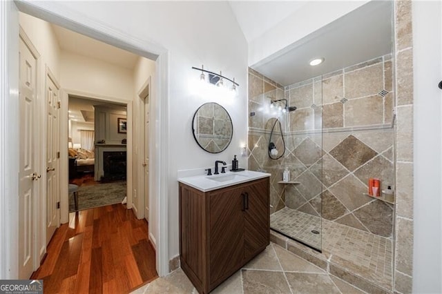 525 Avala Ct, Johns Creek, GA 30022 - full bathroom featuring vanity, ensuite bath, tiled shower, and wood finished floors