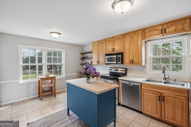 3220 Casteel Rd, Marietta, GA 30062 - kitchen with stainless steel appliances, butcher block counters, light tile patterned floors, and tasteful backsplash