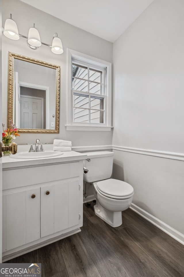 3220 Casteel Rd, Marietta, GA 30062 - half bath featuring vanity and wood finished floors